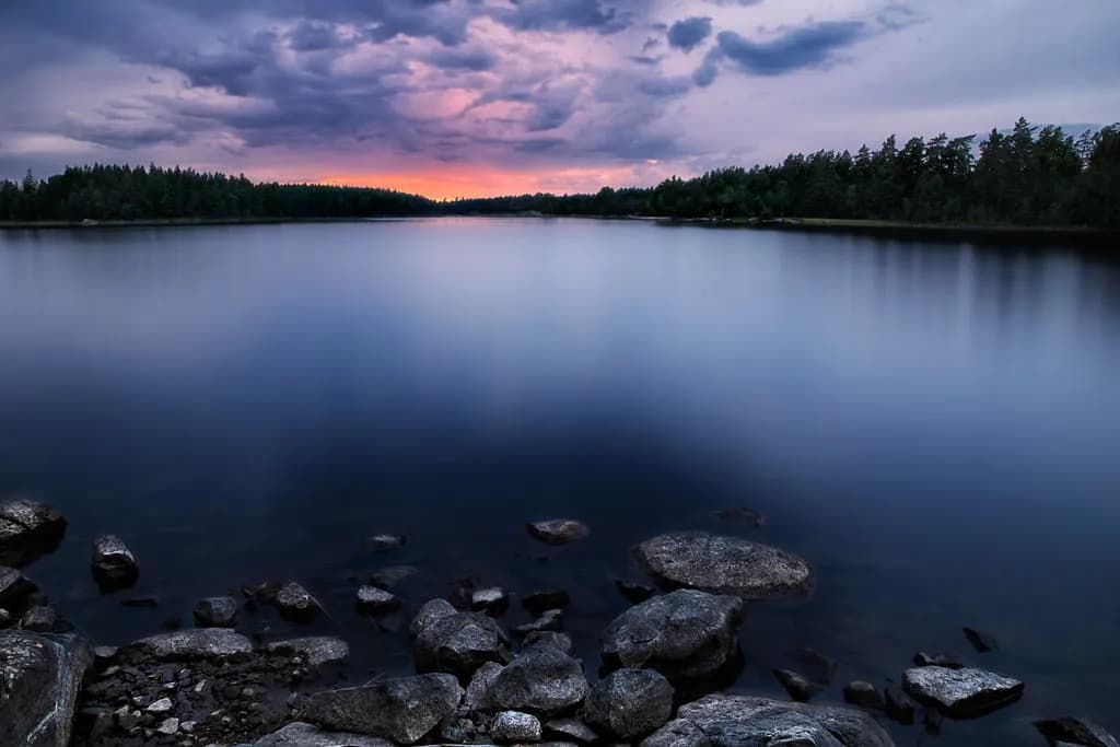Travelers enjoying a cool forest lake during summer