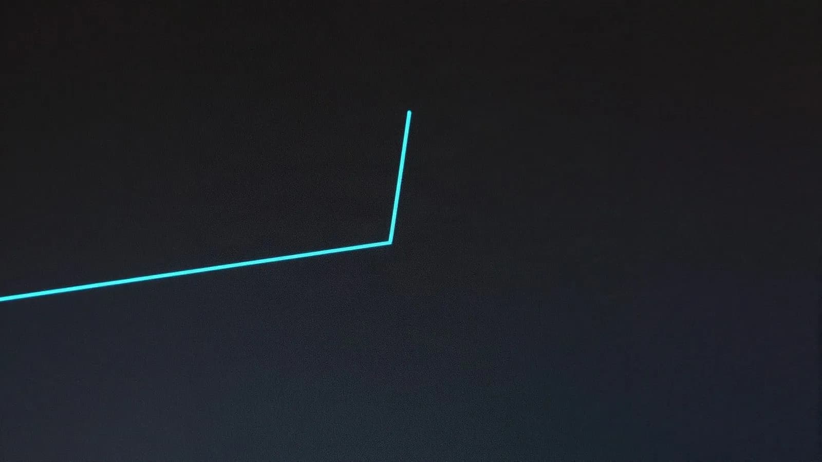 A price line on a dark screen making a single sharp jump upward