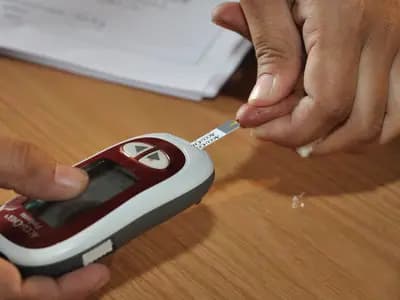 A blood glucose meter with a test strip