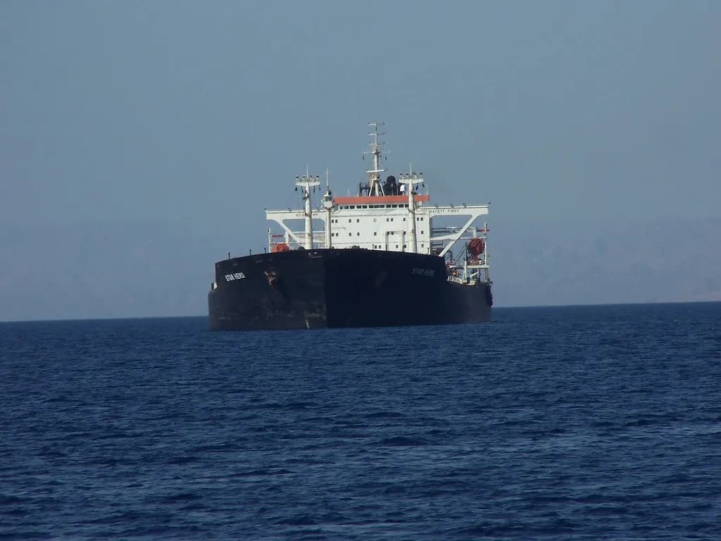 Commercial ships moving through Gulf waters near the Strait of Hormuz