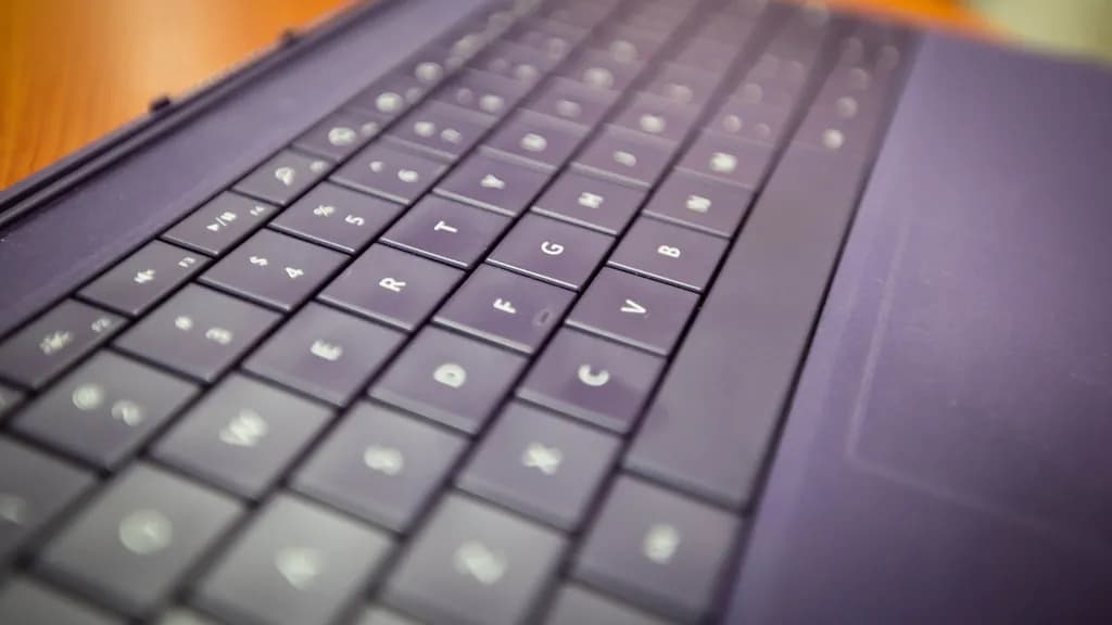 Close-up of a smartphone screen showing a chat assistant app open in a person's hands.