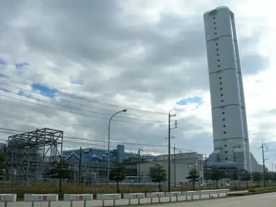 An LNG carrier beside a modern gas and electricity terminal