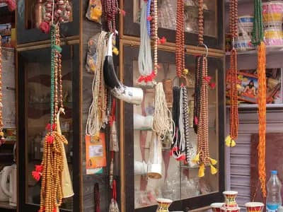 Japa mala, the strings of beads used to count repetitions of a mantra, hanging for sale at a shop in Varanasi