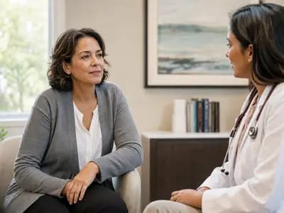 A midlife woman discussing health concerns in a calm setting