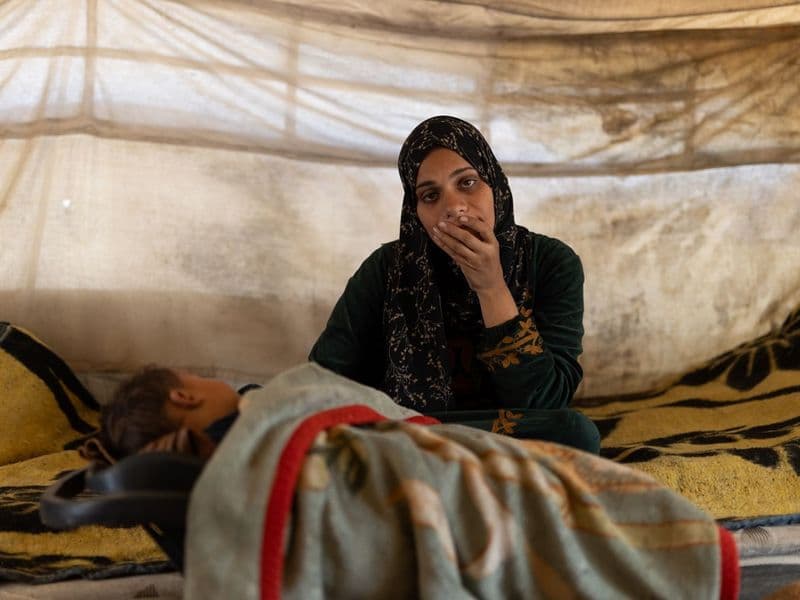 A family offering one another calm practical support during a period of conflict