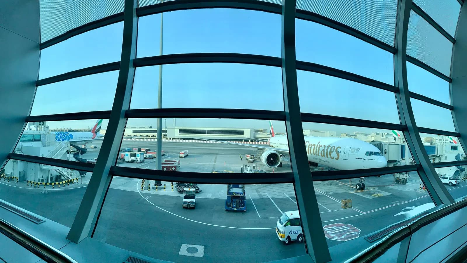 Aircraft at the gates seen from inside Terminal 3 at Dubai International Airport, photographed in 2019