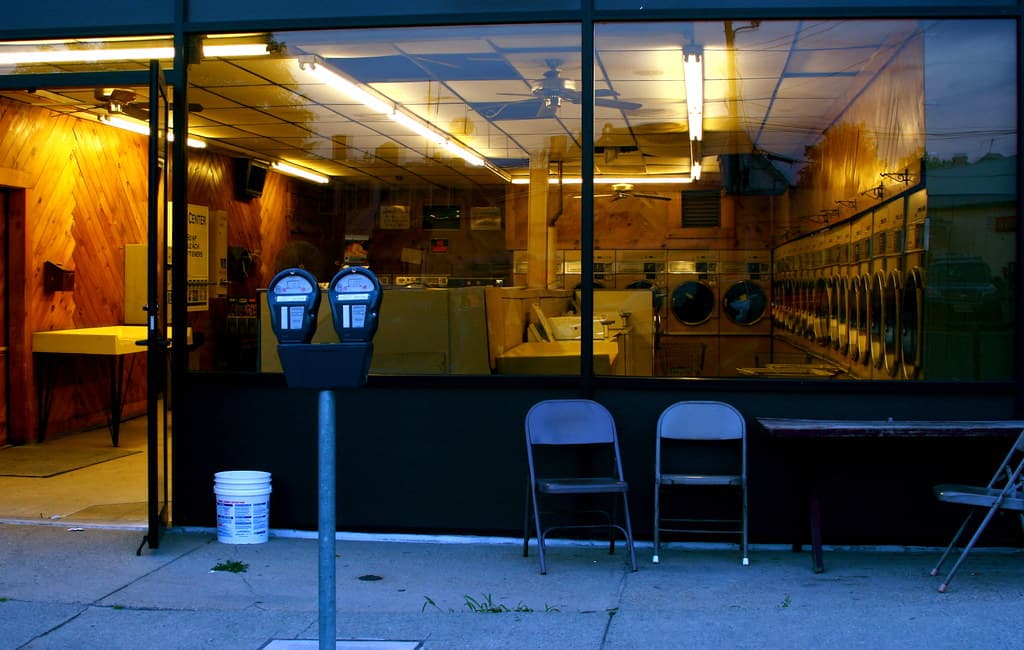 Two people talking across a small café table during a first date