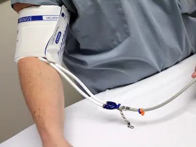 A weekly injection pen device positioned next to a stethoscope on a clinical countertop