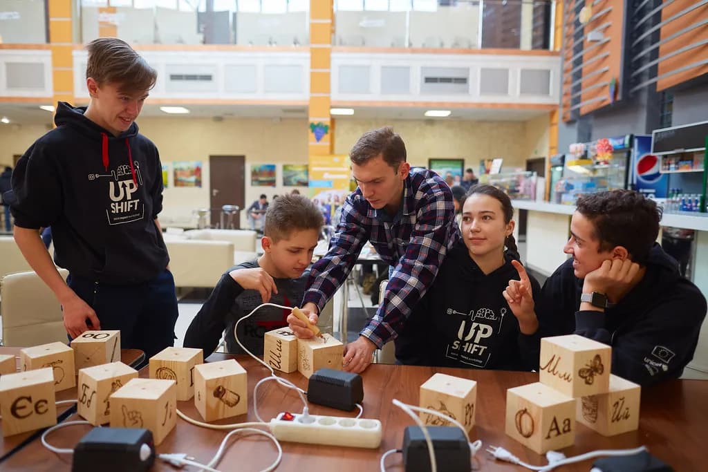 Young participants collaborating on a technology startup idea during a hands-on bootcamp
