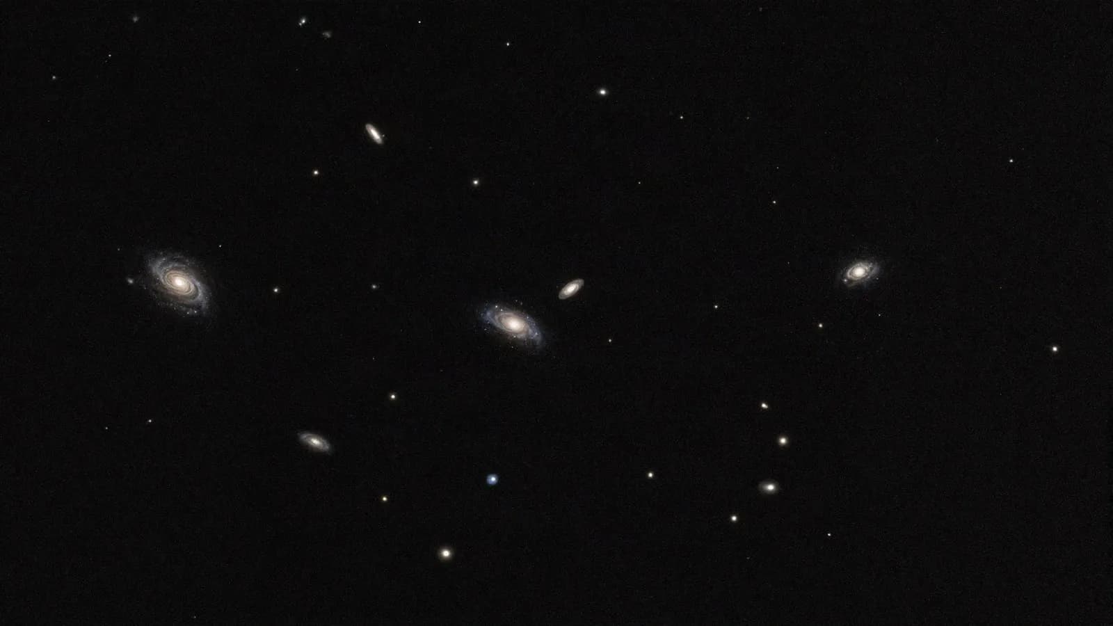 A wide field of sky scattered with distant galaxies of similar scale