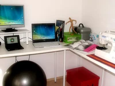 A small apartment living space with open-concept layout, multifunctional furniture, and strategic vertical storage