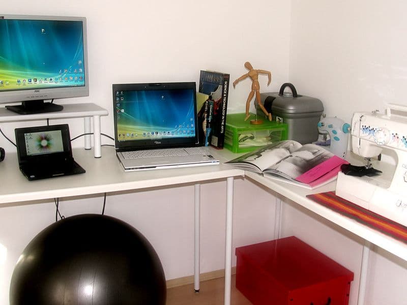 A small apartment living space with open-concept layout, multifunctional furniture, and strategic vertical storage