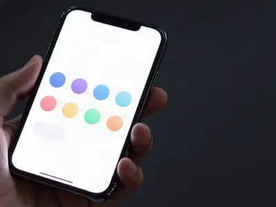 A phone showing a grid of blank app icons