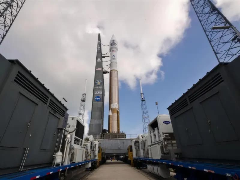 A rocket standing on a launch pad at dusk
