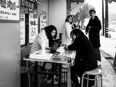 Two people in conversation across a table