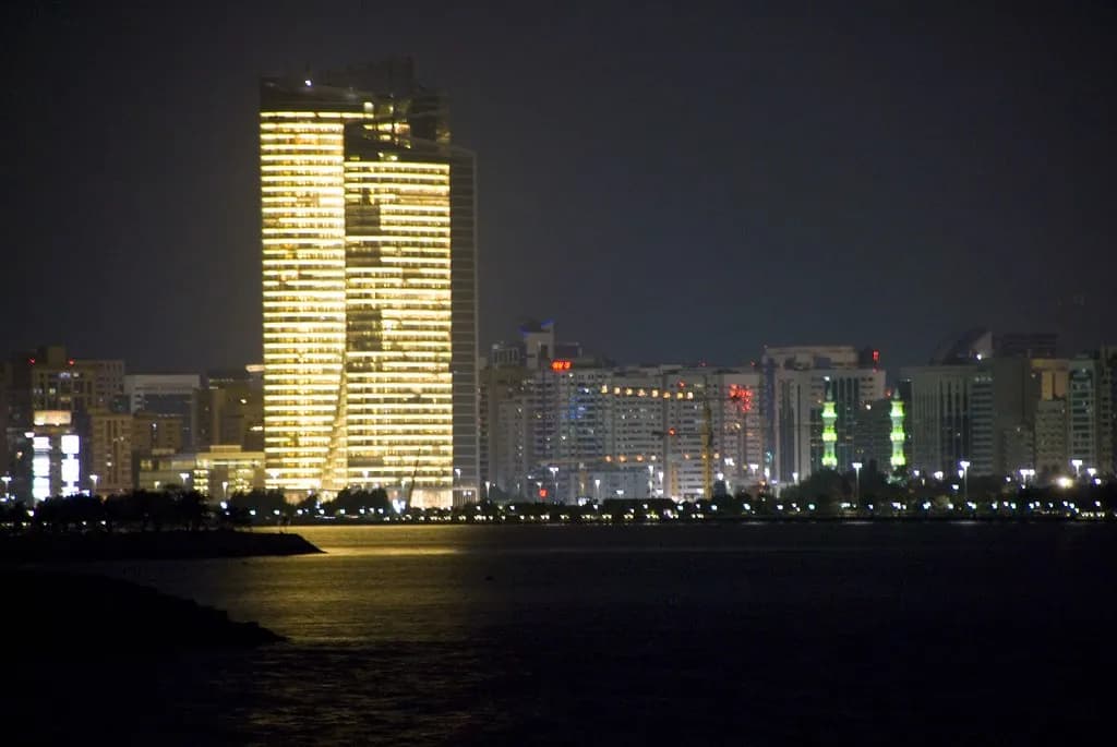 Financial screens overlooking the modern business district in the UAE