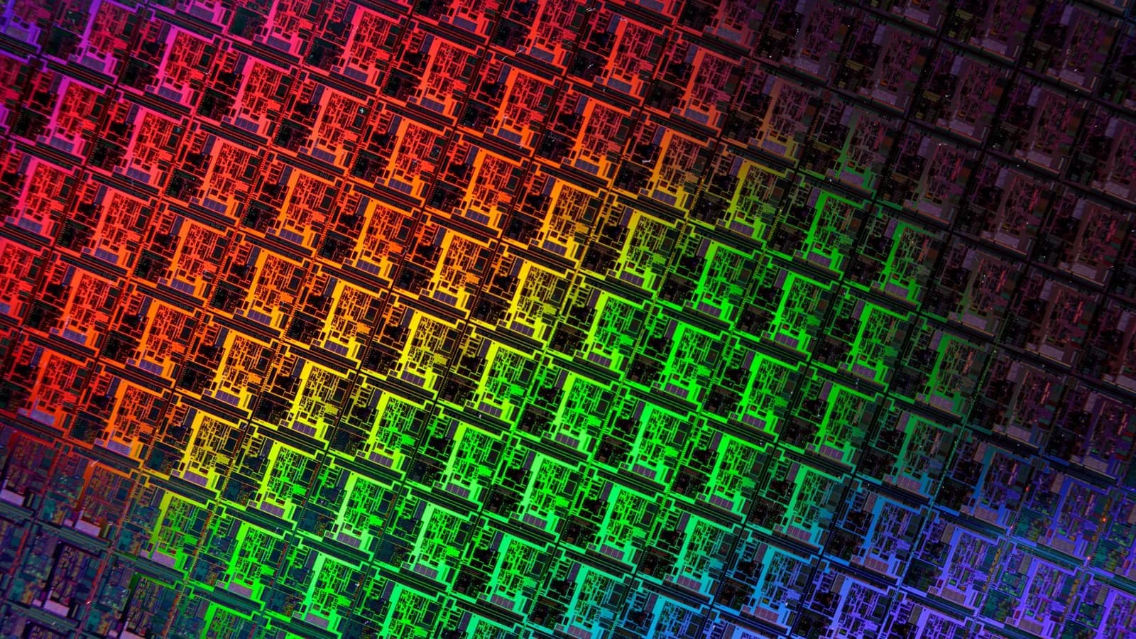 A close view of repeated circuit dies patterned across a silicon wafer