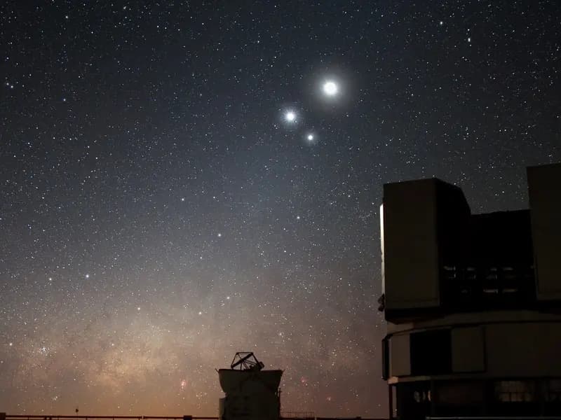 The domes of ESO's Very Large Telescope at Paranal in Chile under the night sky in December 2009; the study used its MUSE spectrograph