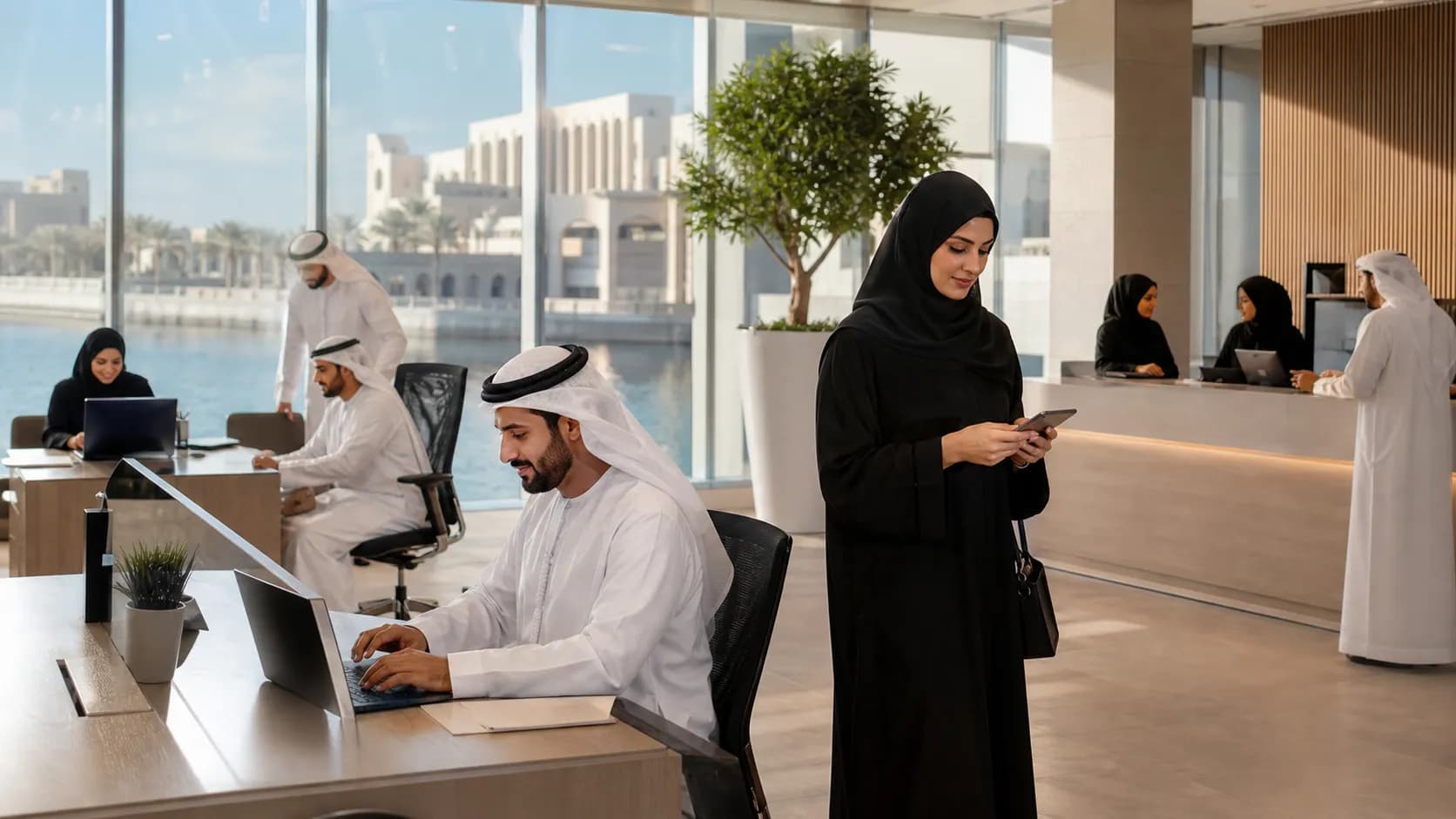 Employees in a modern UAE office working through a more focused summer schedule