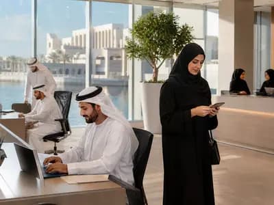 Employees in a modern UAE office working through a more focused summer schedule