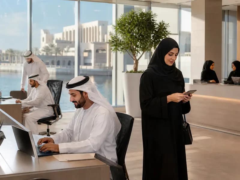 Employees in a modern UAE office working through a more focused summer schedule