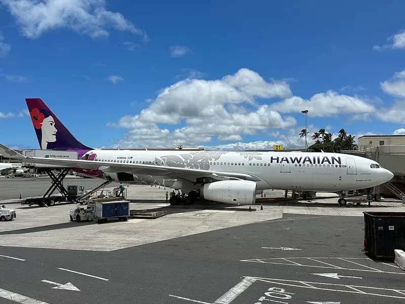 A Hawaiian Airlines Airbus A330-200 parked at a gate at Daniel K. Inouye International Airport in Honolulu, photographed on 21 June 2024, a file photograph of the aircraft type and not of a new Seattle service