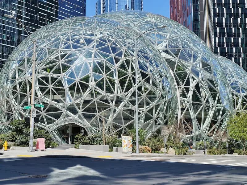 The glass and steel Amazon Spheres conservatories among office towers on the Amazon headquarters campus in Seattle, seen from 6th Avenue with pedestrians on the pavement, photographed on 9 April 2020, a file photograph of the company's campus and not of the earnings report