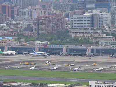 Taipei's Songshan Airport observation deck, illustrative of Taiwan air travel and not a Starlux aircraft, photographed in April 2026