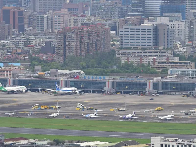 Taipei's Songshan Airport observation deck, illustrative of Taiwan air travel and not a Starlux aircraft, photographed in April 2026