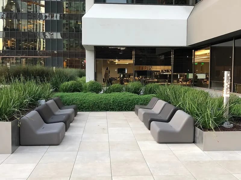 An outdoor breakout terrace with tables and planting at an office building on Main Street in the South of Market district of San Francisco, photographed on 12 December 2018, a file photograph of a tech-district office and not of Anthropic