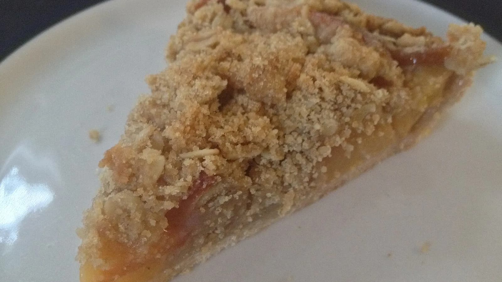 A slice of apple crumb pie with an oat streusel topping on a white plate, photographed on 14 August 2014, a file photograph of the dish and not of the Starbucks or Trader Joe's pies
