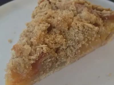 A slice of apple crumb pie with an oat streusel topping on a white plate, photographed on 14 August 2014, a file photograph of the dish and not of the Starbucks or Trader Joe's pies