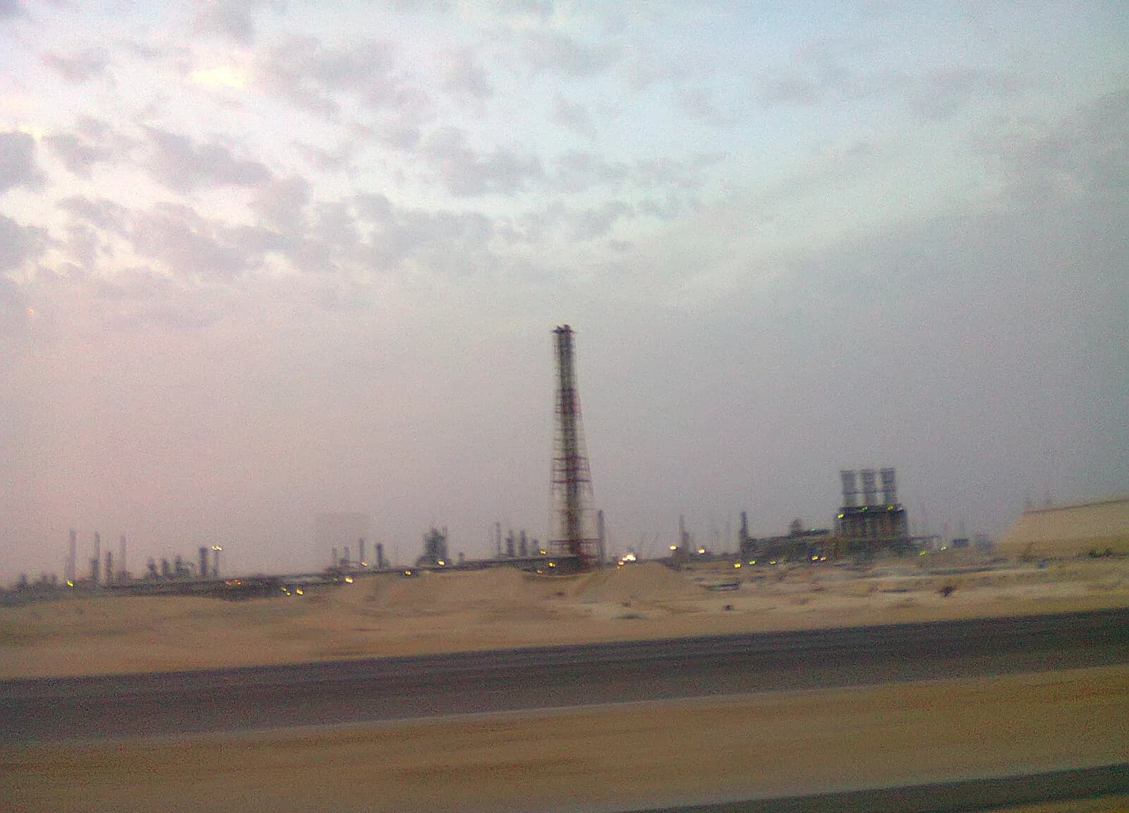 A crude oil tanker alongside a refinery loading terminal