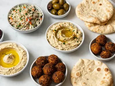 A Lebanese mezze spread of hummus, tabbouleh and falafel