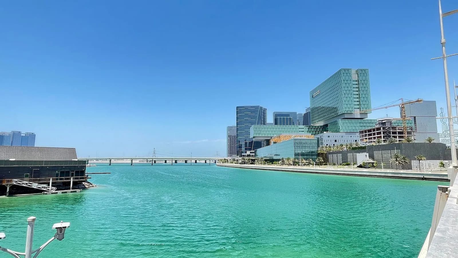 The turquoise waterfront and glass office towers of Al Maryah Island in Abu Dhabi, the financial district that houses the Abu Dhabi Global Market and its regulator, photographed on 12 May 2021, a file photograph of the district and not of the regulator's statement