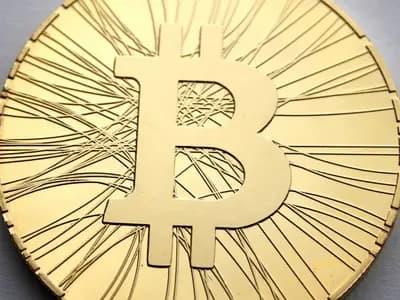 A close-up of a gold-coloured physical bitcoin collector coin on a grey surface, photographed in October 2013, a file photograph illustrative of bitcoin and not of the exchange-traded funds