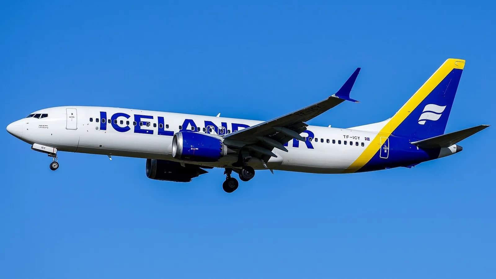 A Boeing 737-8 MAX in an Icelandair livery on final approach against a clear blue sky near Berlin Brandenburg Airport, photographed on 24 February 2024, a file photograph illustrative of the 737 MAX family and not of any aircraft in Boeing's quarterly deliveries