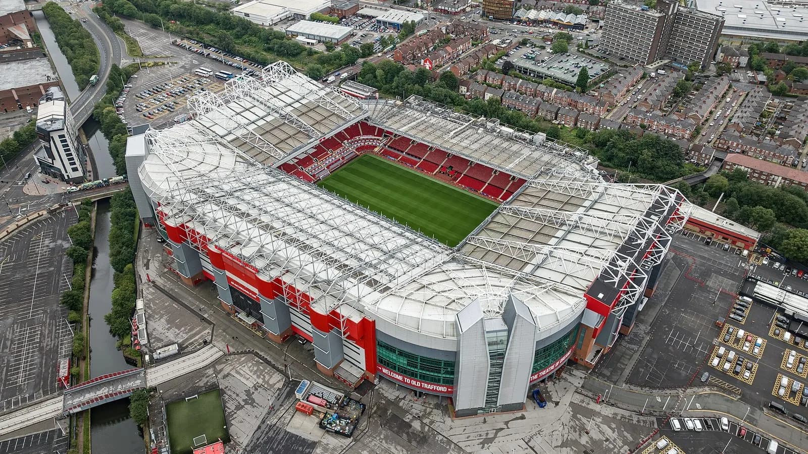 An aerial view of Old Trafford in Manchester with its red-seated stands and green pitch, photographed on 31 July 2023, a file photograph of the stadium and not from Sunday's match