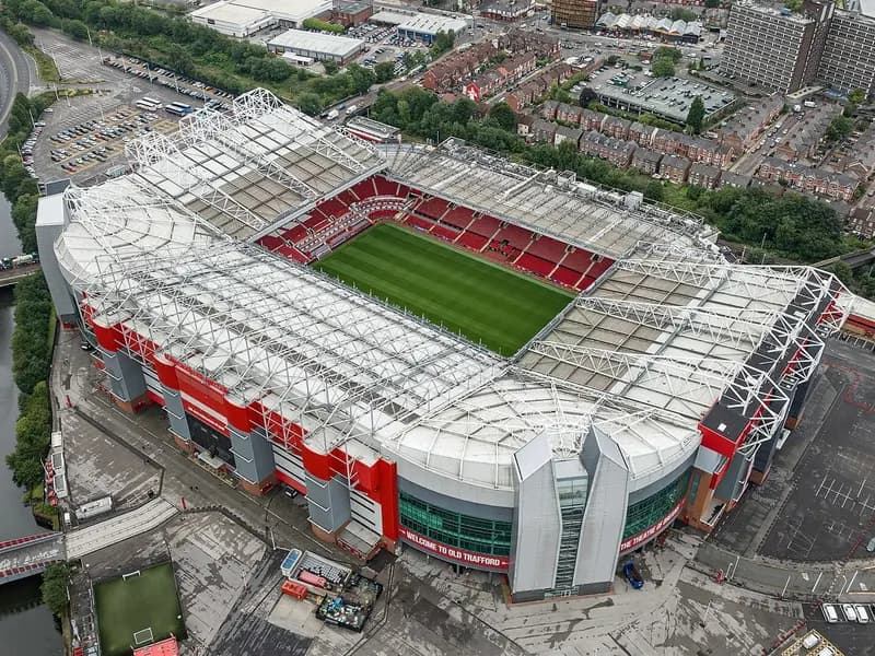 An aerial view of Old Trafford in Manchester with its red-seated stands and green pitch, photographed on 31 July 2023, a file photograph of the stadium and not from Sunday's match