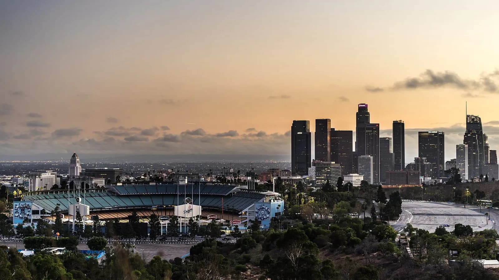 Dodger Stadium in Los Angeles with the downtown skyline behind it at sunset, photographed on 15 October 2016, a file photograph of the ballpark and not from Thursday's NLCS Game 4