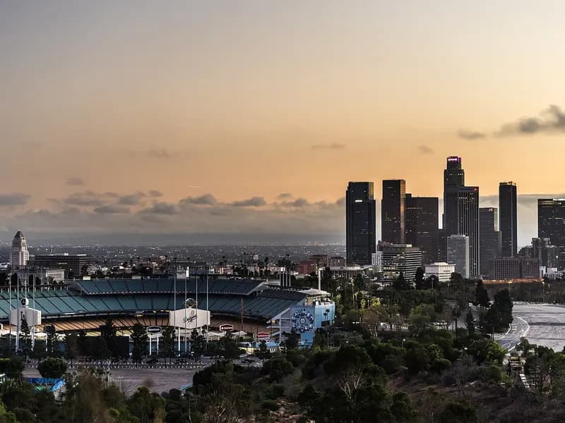 Dodger Stadium in Los Angeles with the downtown skyline behind it at sunset, photographed on 15 October 2016, a file photograph of the ballpark and not from Thursday's NLCS Game 4