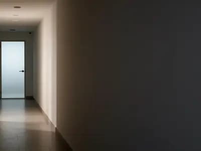 A corridor divided between light and shadow