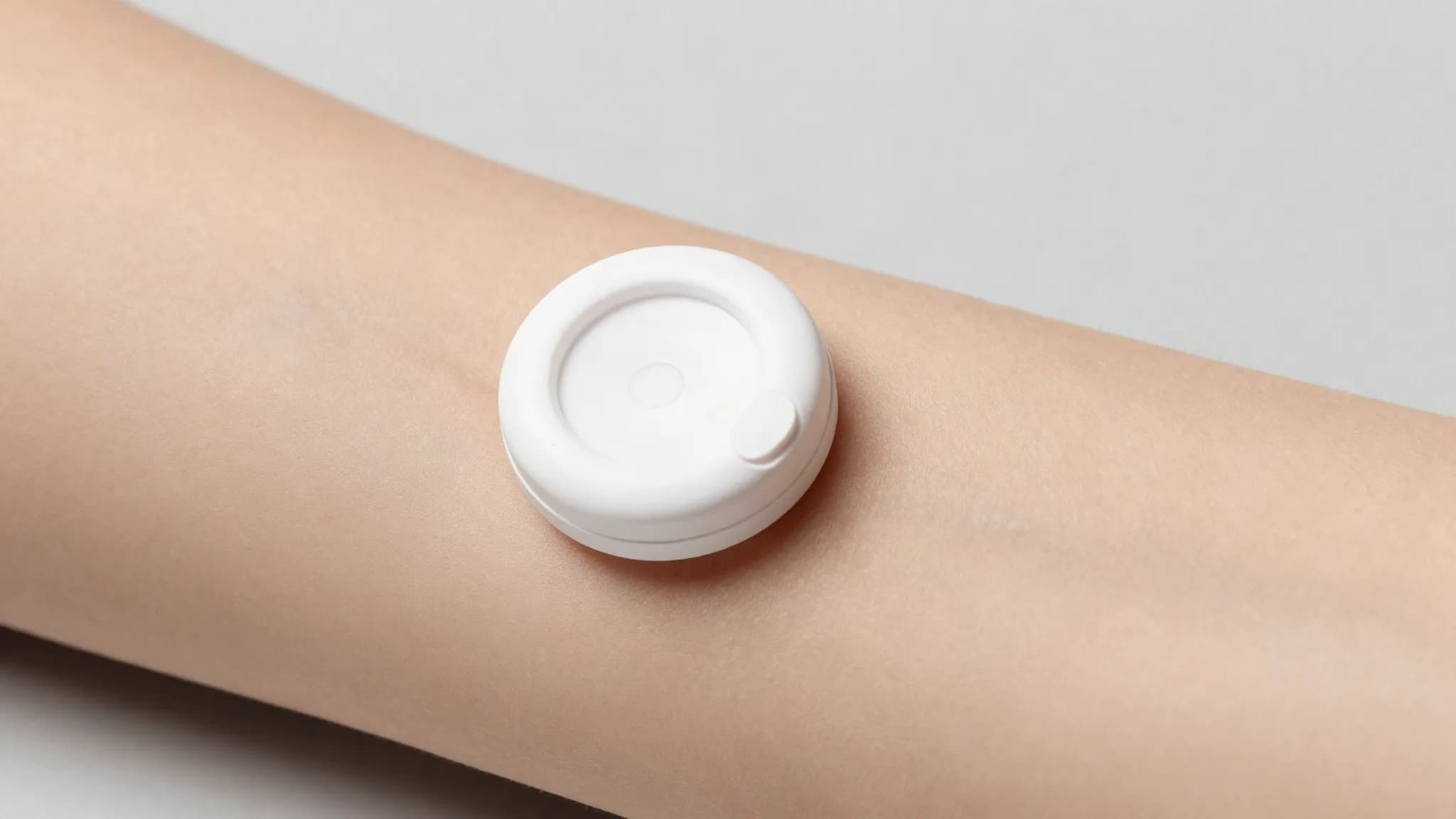 A continuous glucose sensor worn on an upper arm