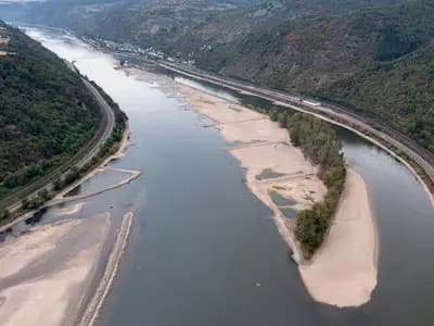 The Rhine at Bacharach with its gravel bed exposed at low water in August 2022, the last time the river ran this dry; Copernicus reports exceptionally low flows again this August