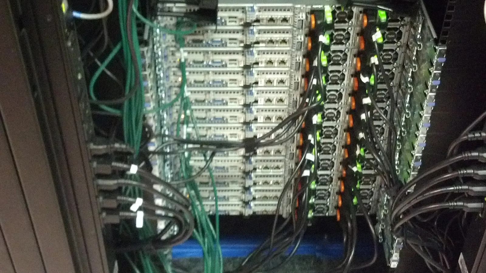 Rows of rack-mounted servers with green network cables inside a data centre cabinet, photographed on 20 June 2013, a file photograph illustrative of data-centre hardware and not of CoreWeave's facilities