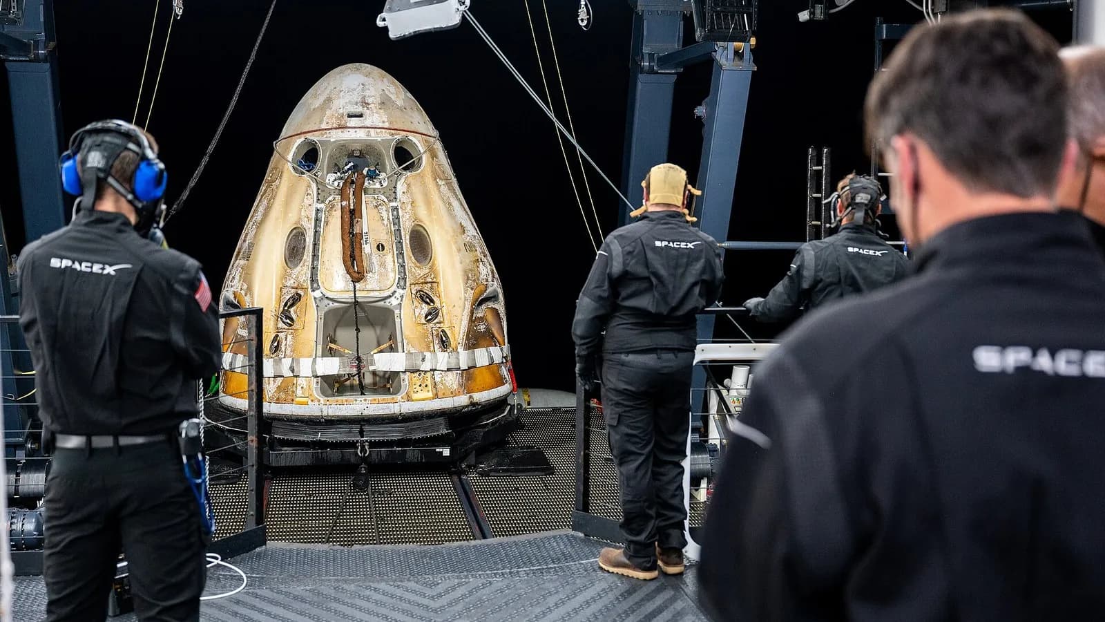 Support teams on the SpaceX recovery ship Shannon working around the Crew Dragon Endurance shortly after it landed with the Crew-5 astronauts, photographed on 11 March 2023, a file photograph of an earlier mission and not of the Crew-12 landing