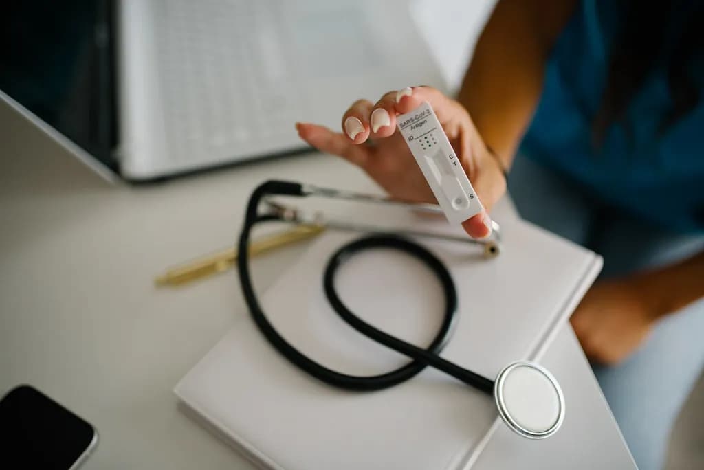 A stethoscope resting on a clinician's desk