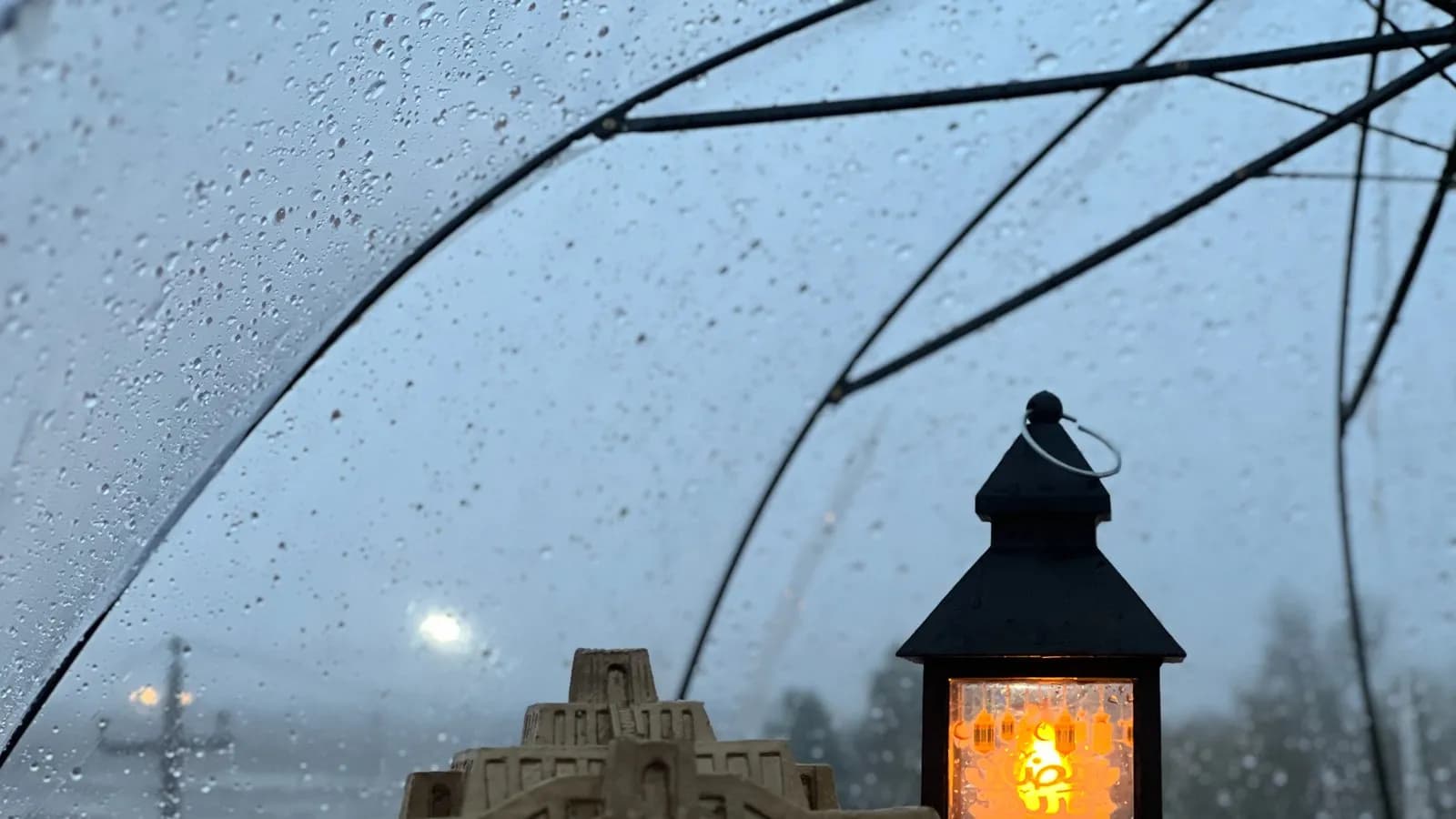A Ramadan lantern lit in the rain