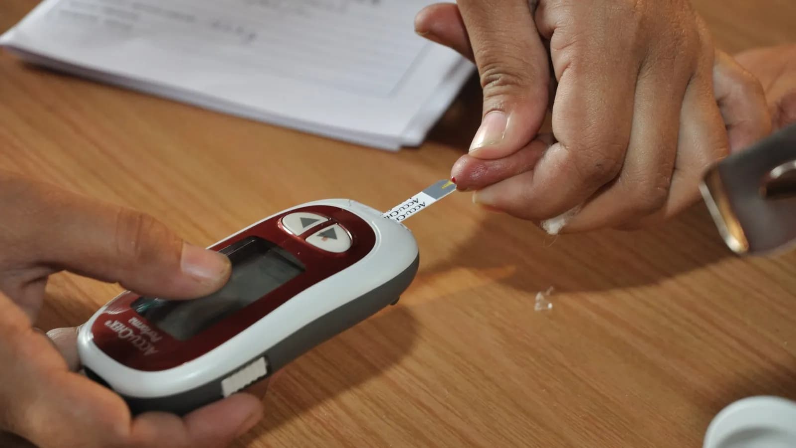 A blood glucose meter with a test strip