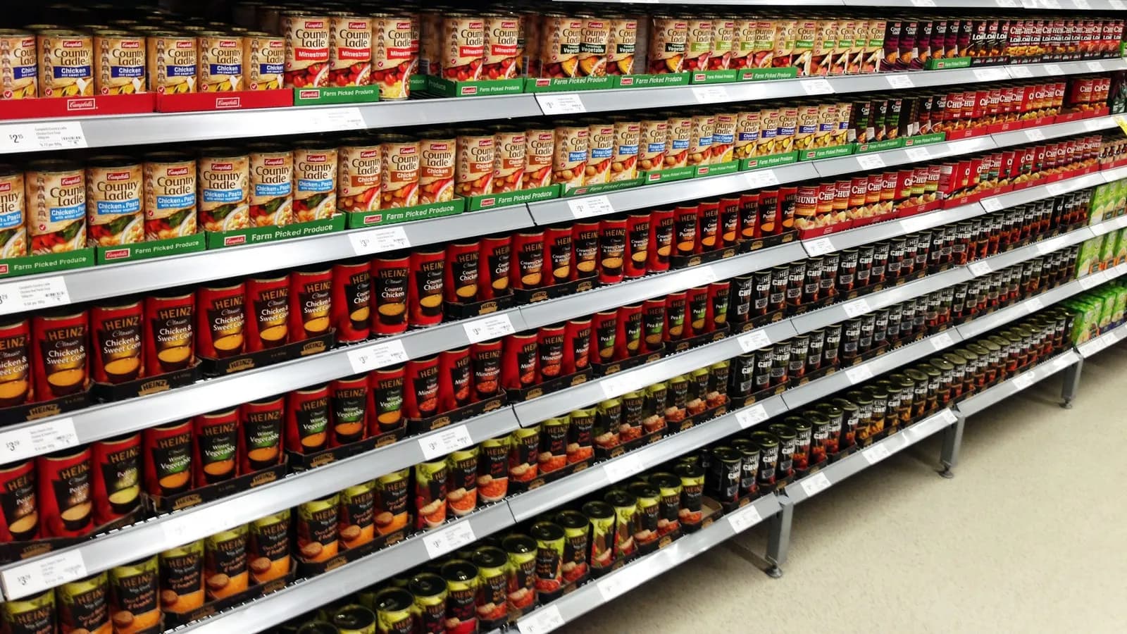 Packaged products faced up on a supermarket shelf